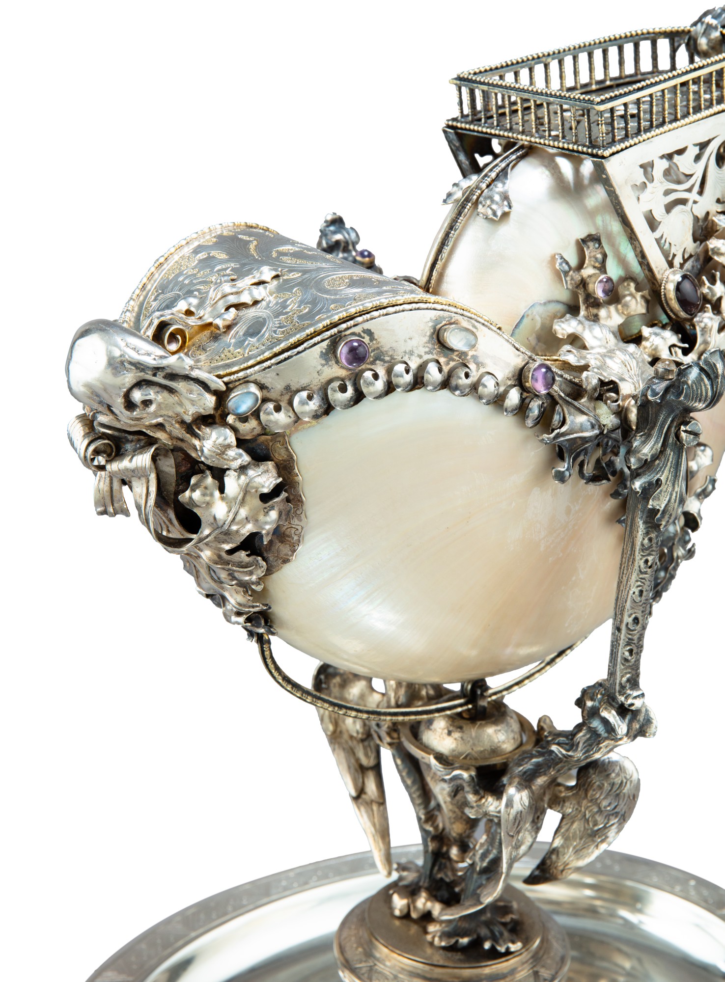 An Austrian nautilus shell cup with silver mounts, red coral and semi