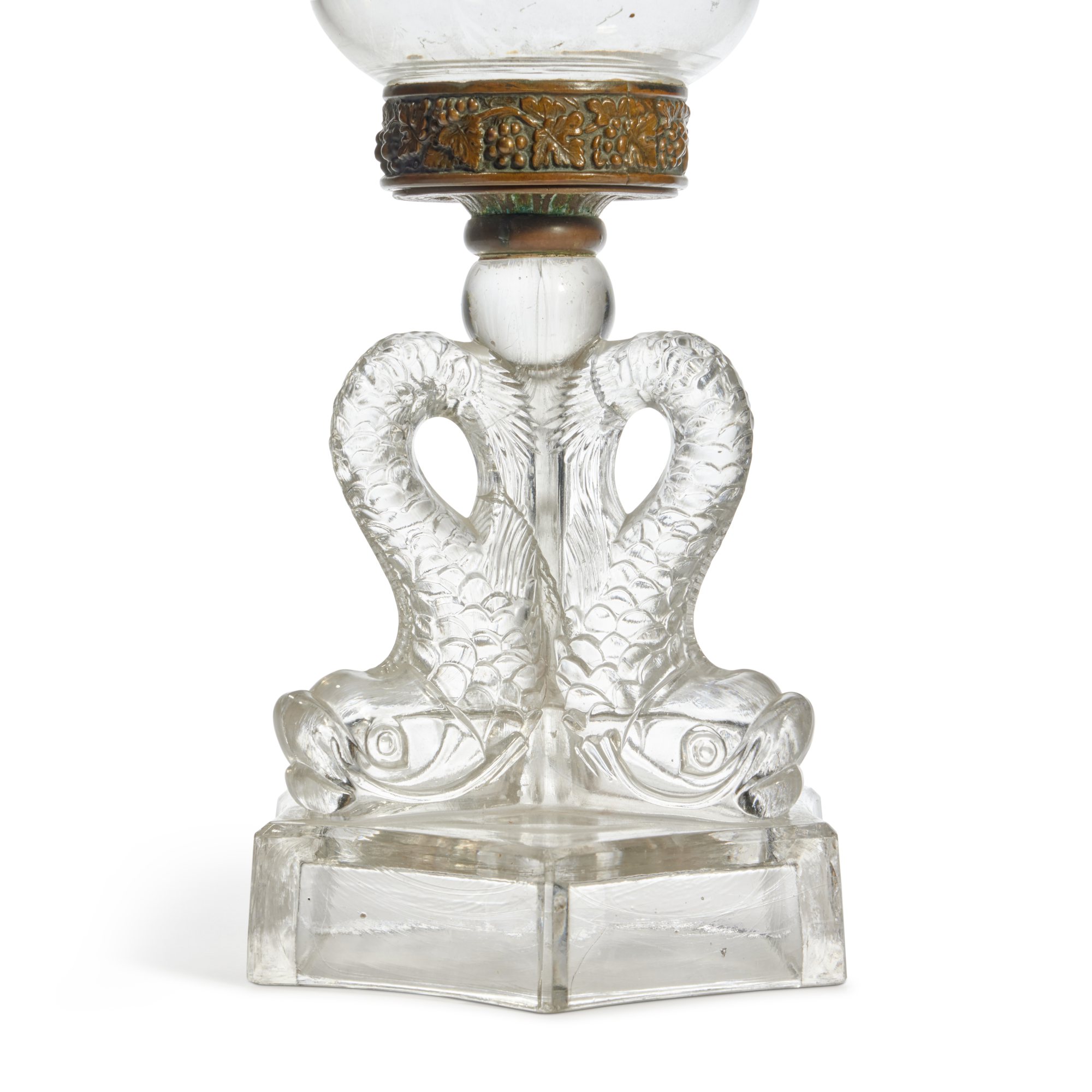 A Rare Molded Colorless Glass and MetalMounted Triple Dolphin Base