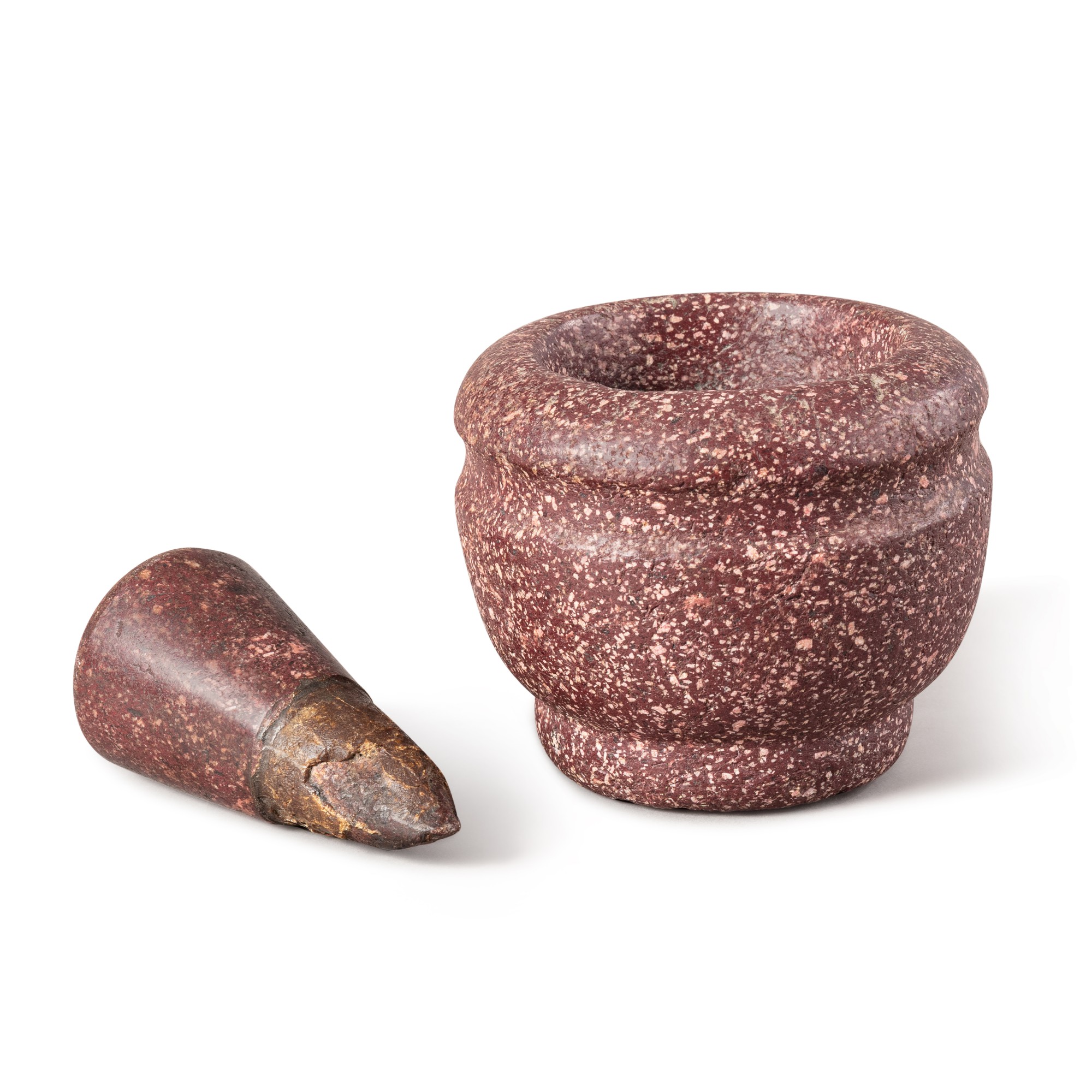 A small Egyptian porphyry mortar and pestle, Italy, 17th century