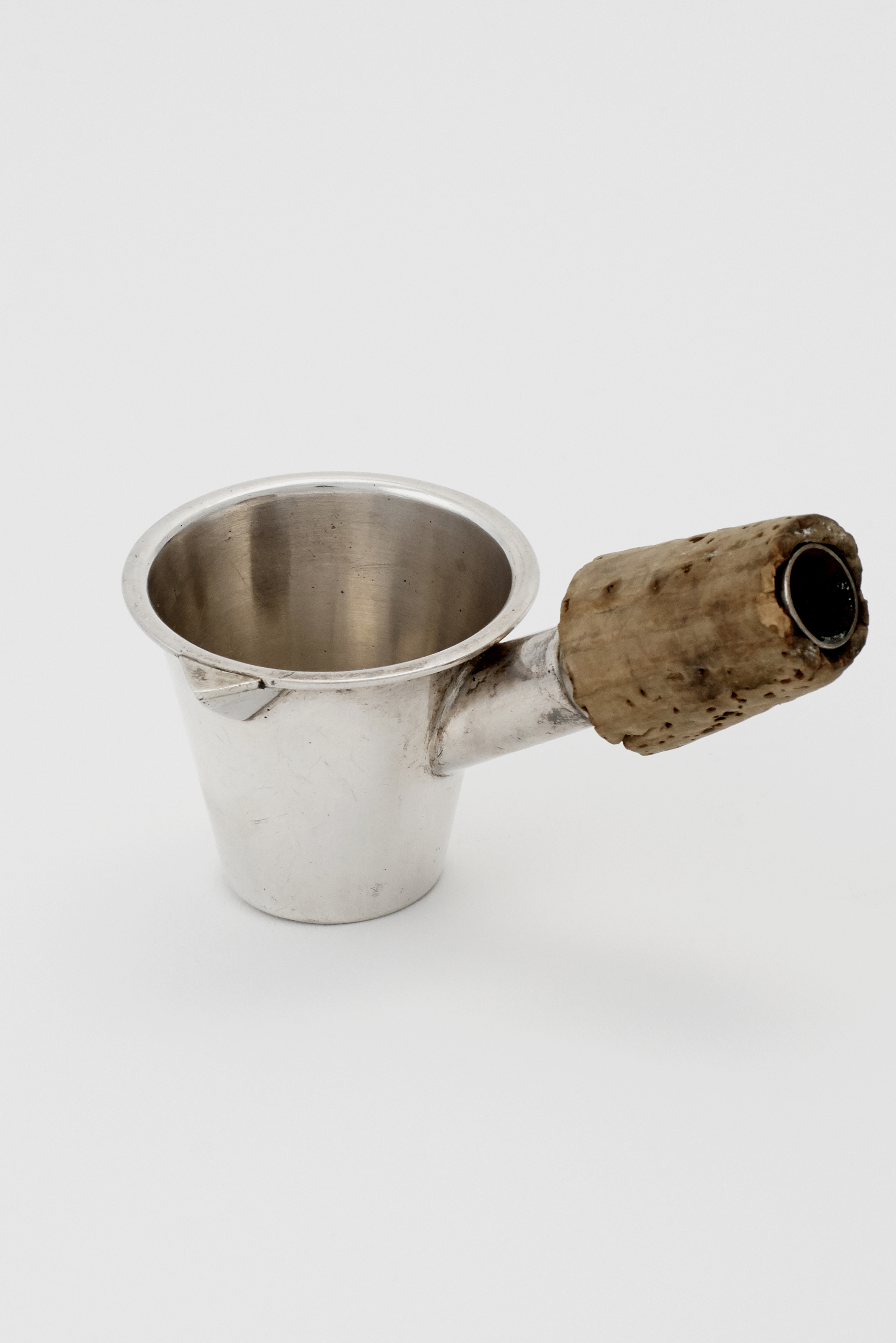 A SET OF THREE SILVER JIGGERS WITH BOTTLE STOPPERS Prohibition in