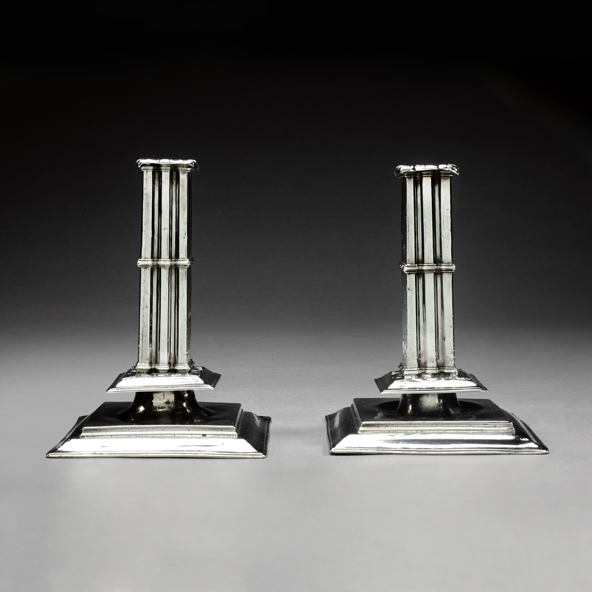 A pair of French silver candlesticks, maker's mark GA attributed to the