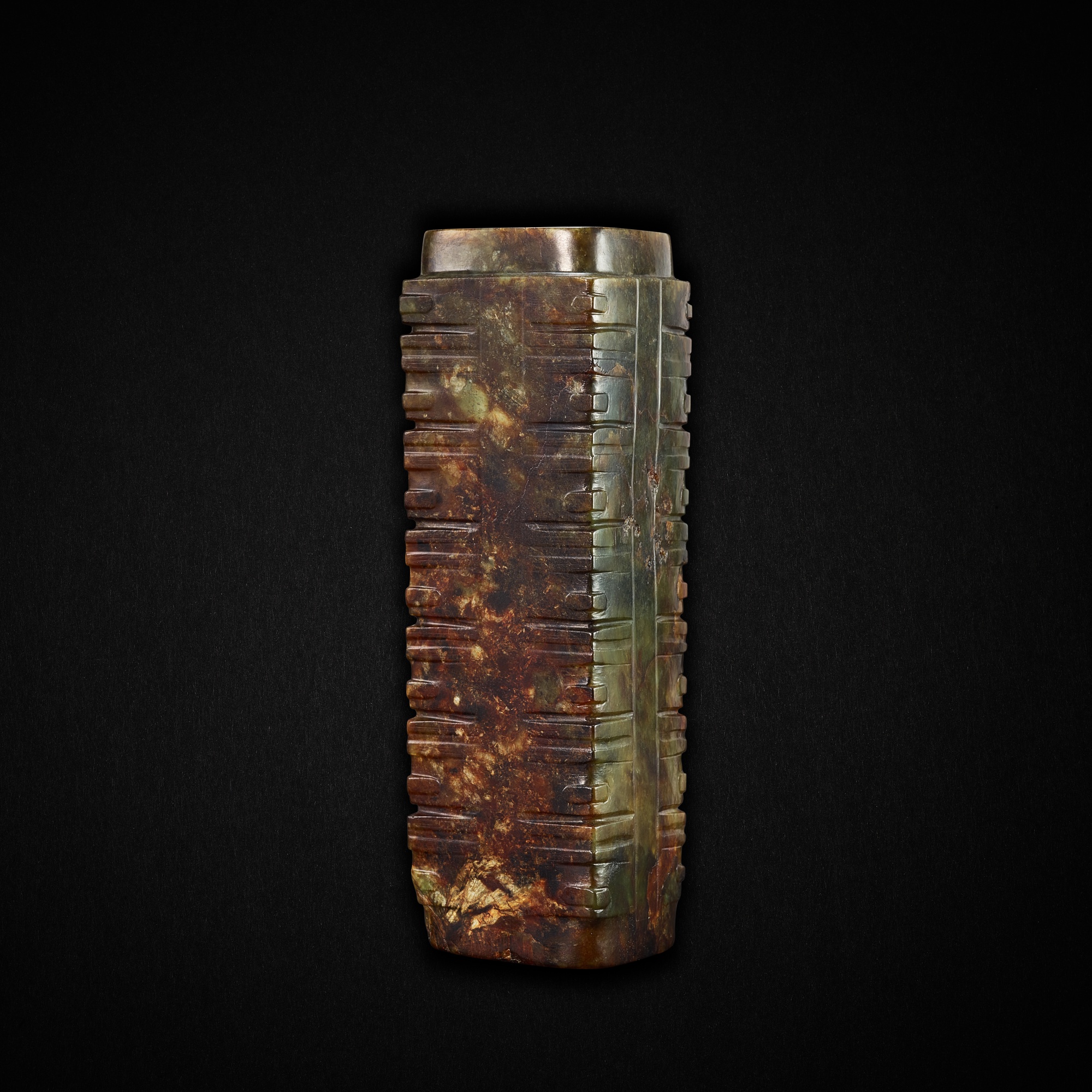 a-rare-green-and-russet-human-face-jade-cong-neolithic-period
