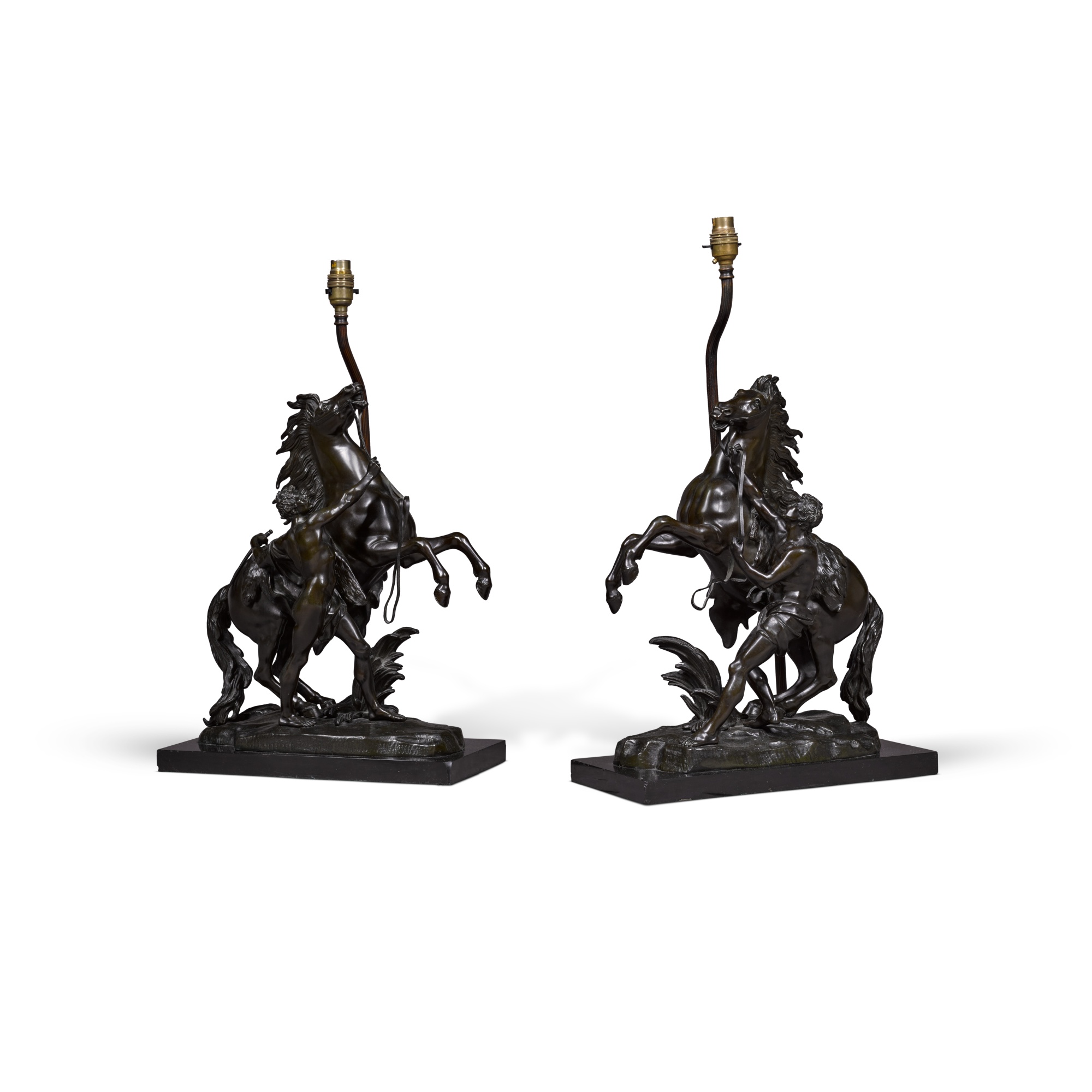 A Pair Of Bronze Casts Of The Marly Horses Later Mounted As Lamps a-pair-of-bronze-casts-of-the-marly-horses-later-mounted-as-lamps