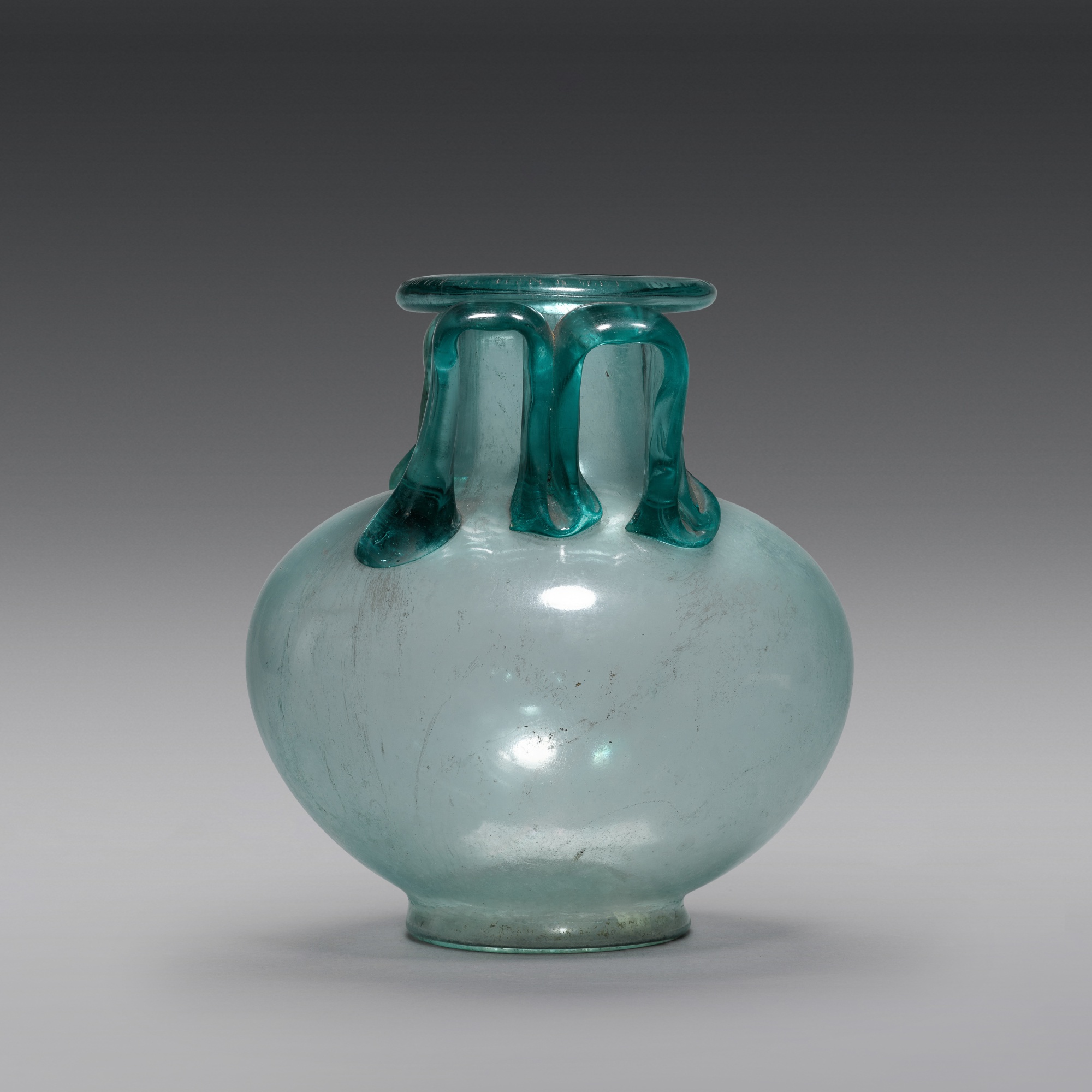A Roman Bluegreen Glass Cinerarium, circa 1st/2nd Century A.D