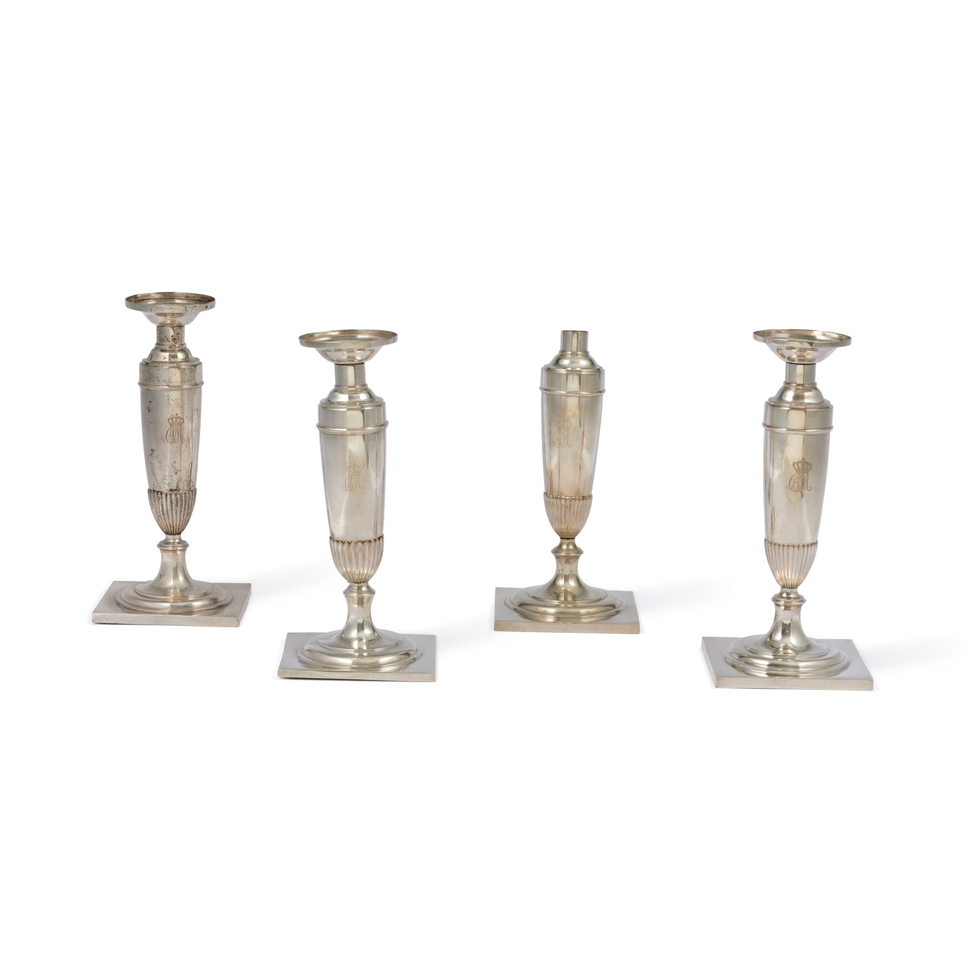 A set of four German silver candlesticks Gruppe von vier