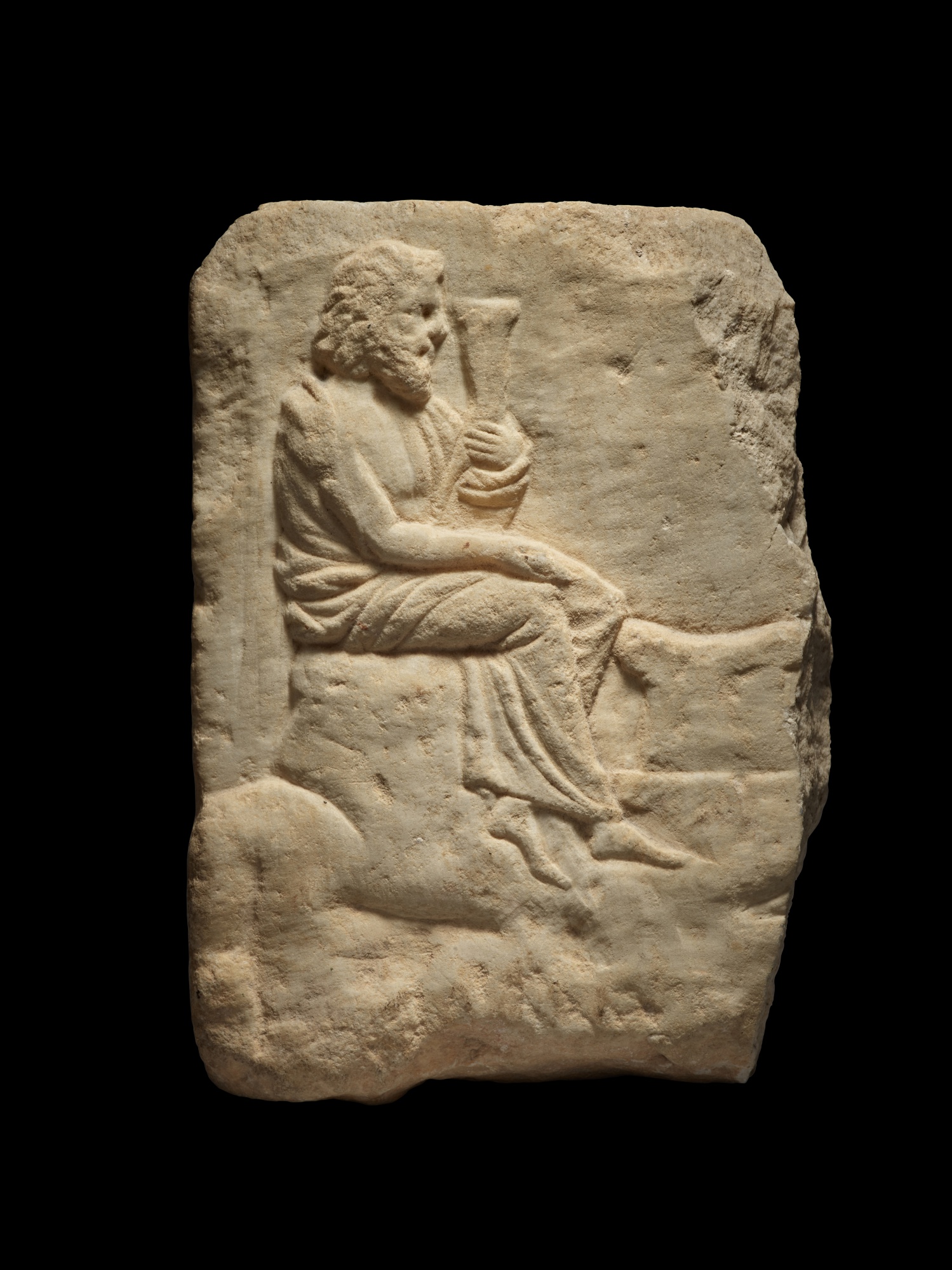 A Greek Marble Votive Relief Fragment, 2nd half of the 4th century B.C