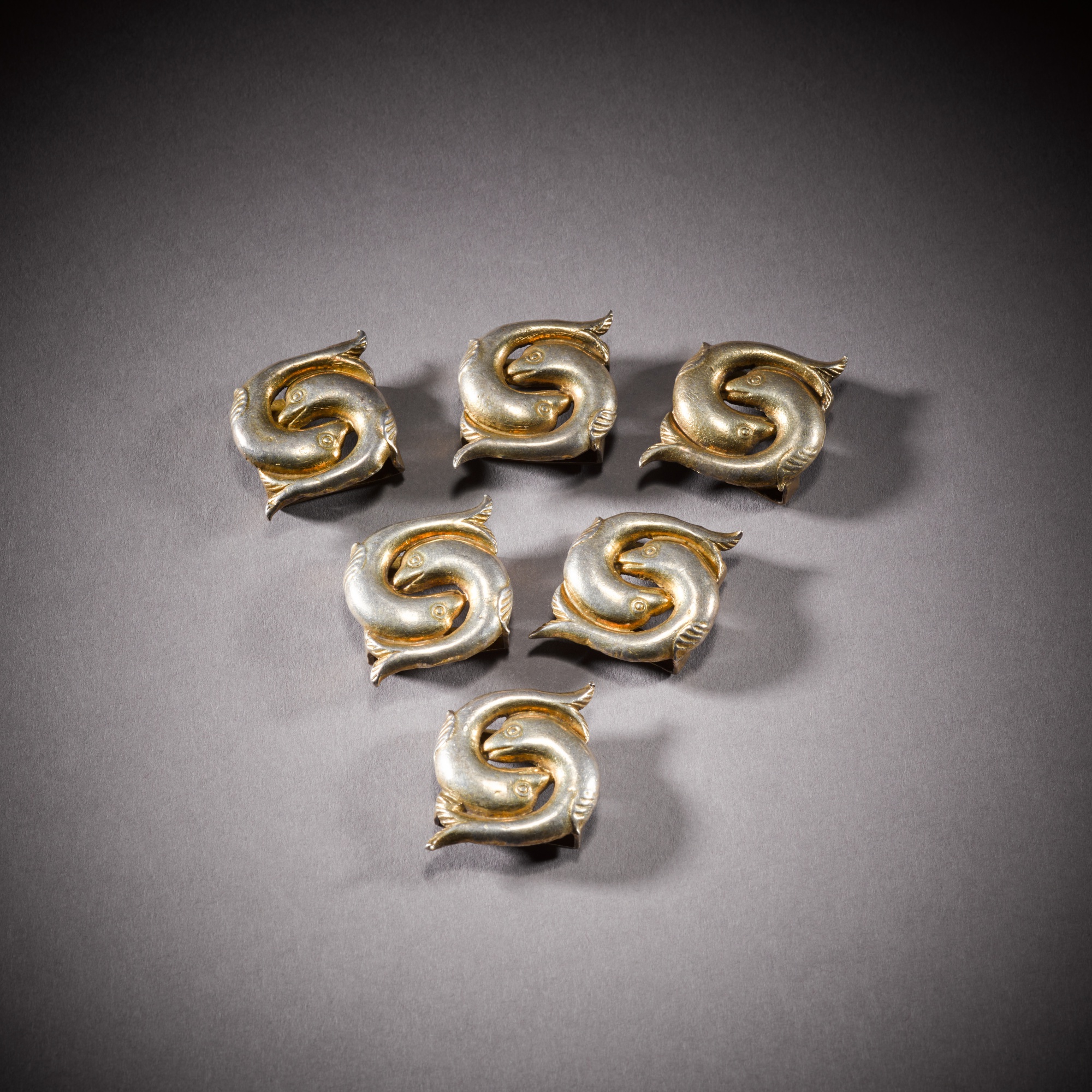 Six Mughal silvergilt bridle ornaments, North India, Delhi or Agra